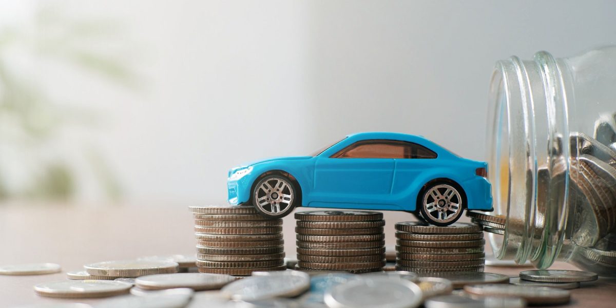 car-tax-concept-financial-statements-with-coins-au-2022-11-09-18-49-13-utc-min.jpg
